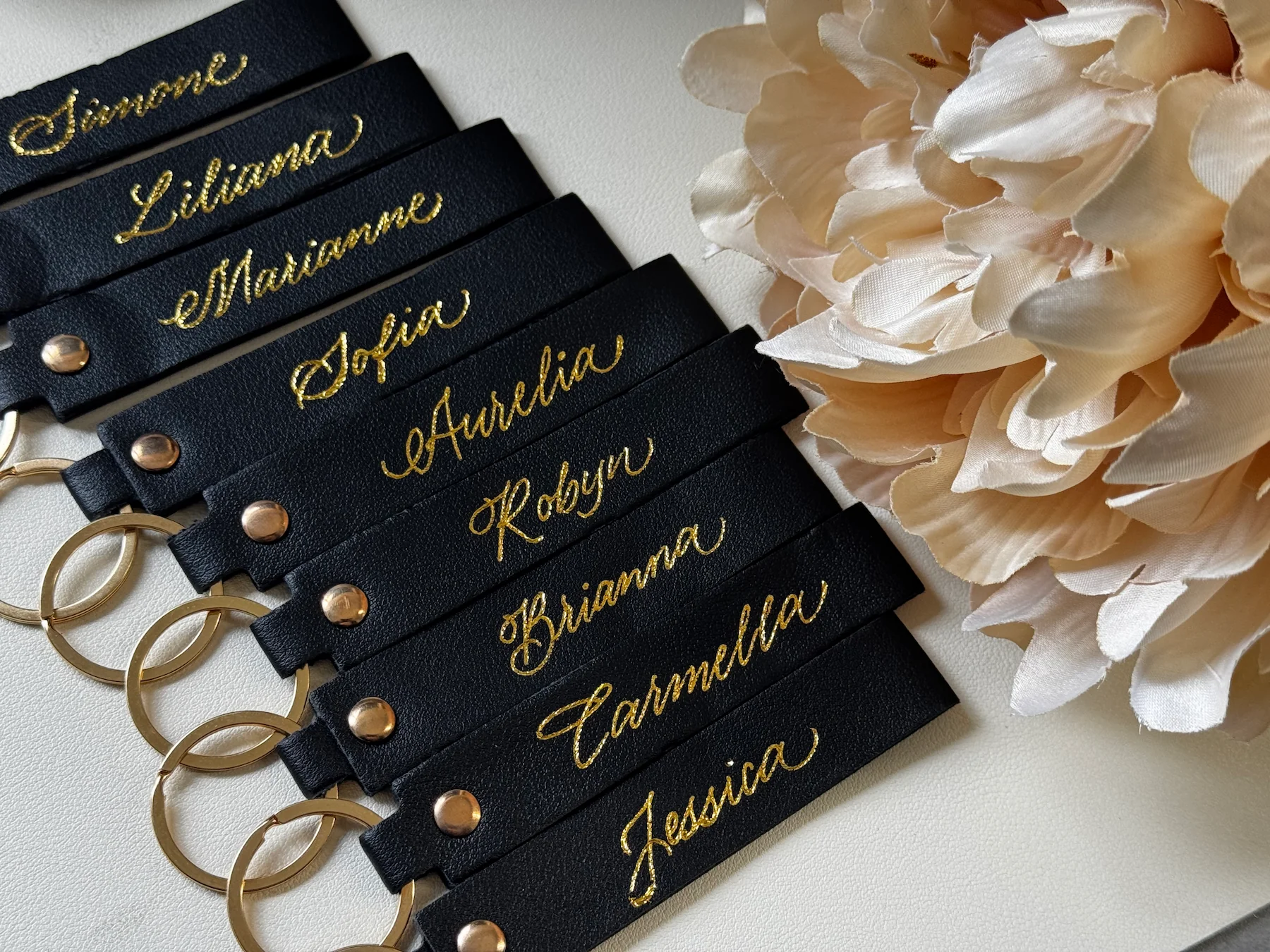 Personalized black leather tags with gold lettering