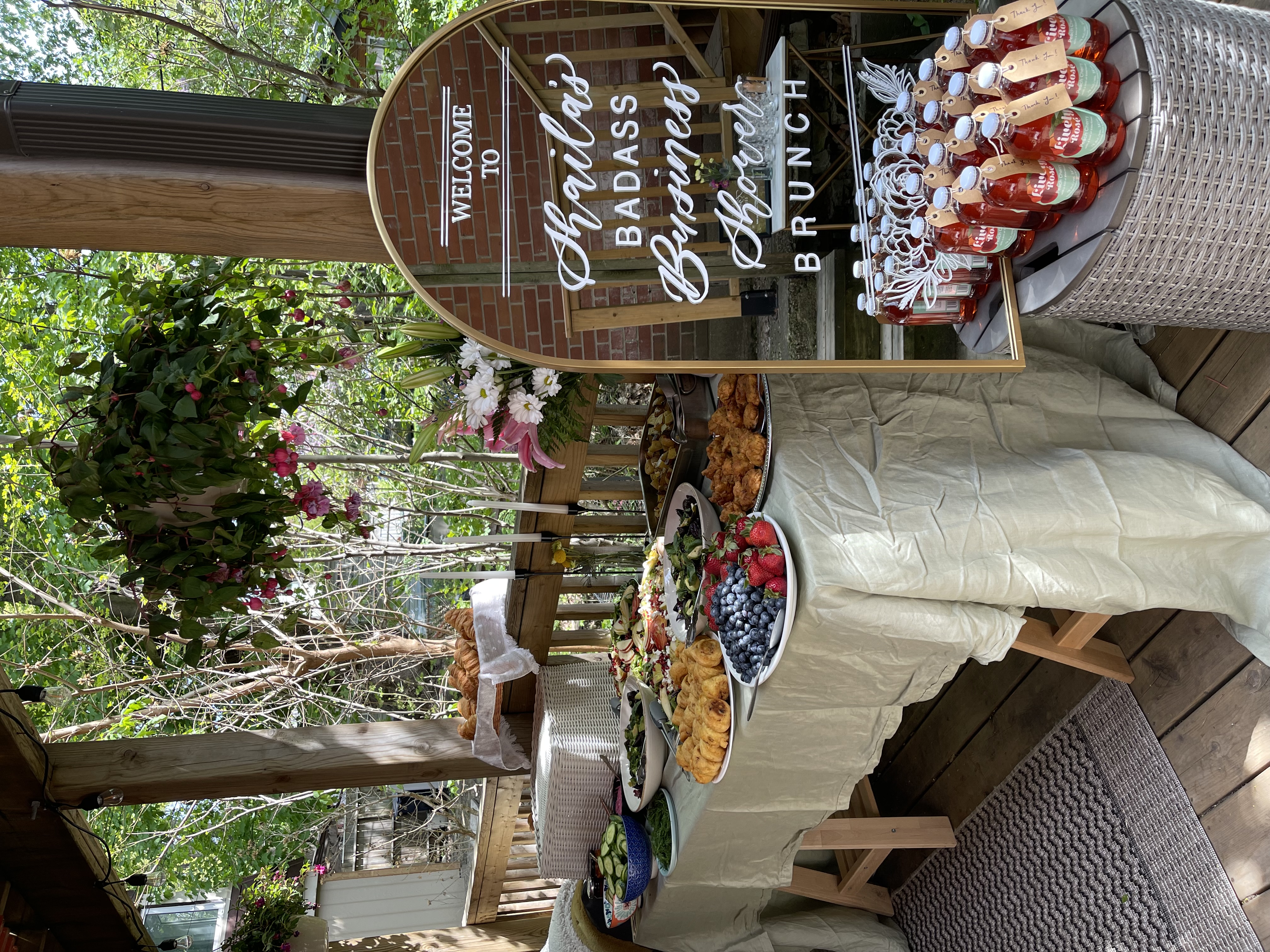 Branded brunch mirror signage and event spread